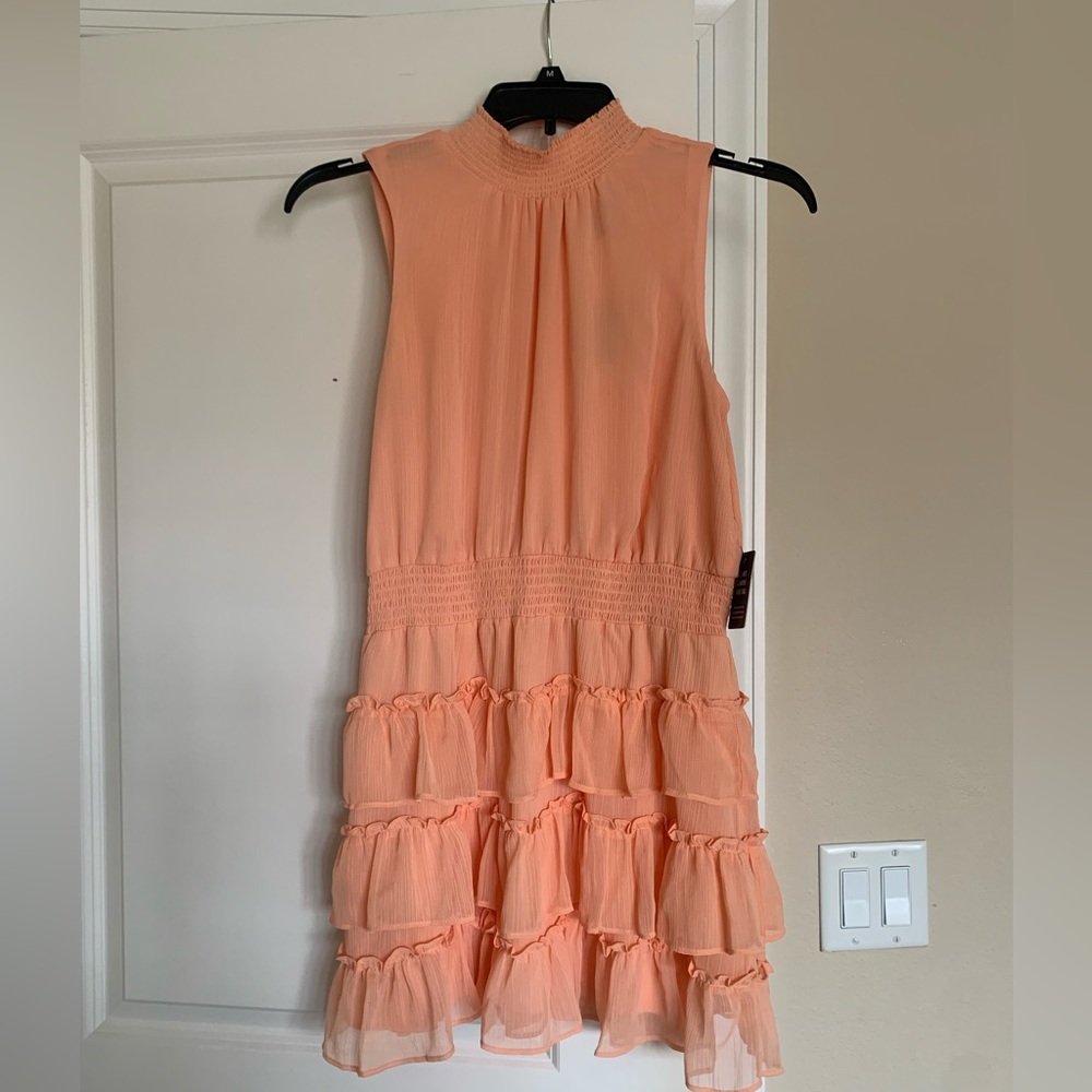 Flounced peach colored above knee dress
